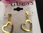 Daiktas Guess gold hearts auskarai